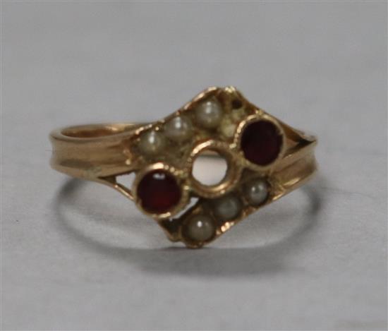 A yellow metal, ruby and split pearl ring (one stone missing), size H.